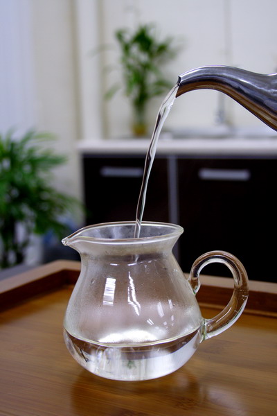 In the mean time, pour the hot water into the pitcher to warm it up.