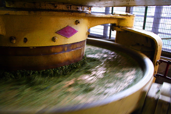 Tea is pressed down on to the turning plate.