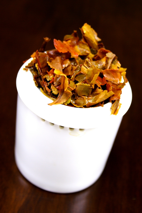 Brewed Tea Leaves displayed on an official inspection cup